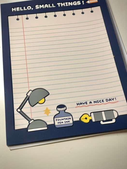 Cute rubber mat with lamp illustration and lined paper design.