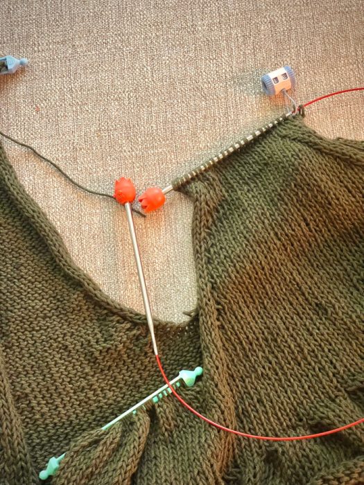 Frills V-Neck Tank Top knitting in progress, green ramie cotton yarn on needles with shoulder section shaping