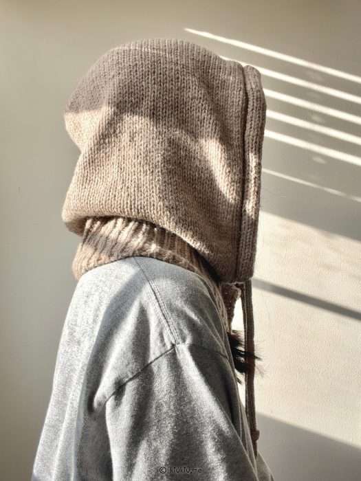 hand-knitted balaclava worn outdoors in natural light