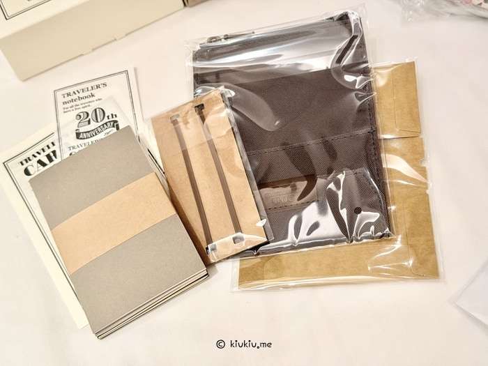 Traveler's Notebook 20th Anniversary Card Size Set unboxing showing the brown leather cover and included accessories